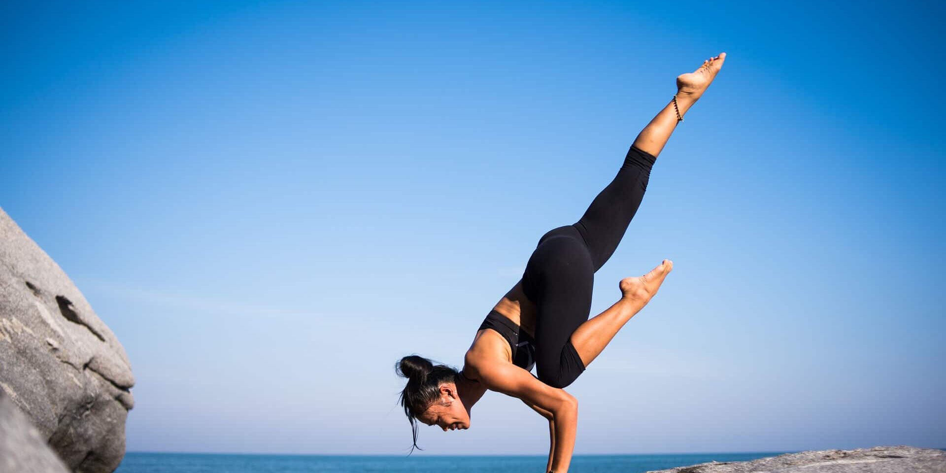 woman doing hand stand